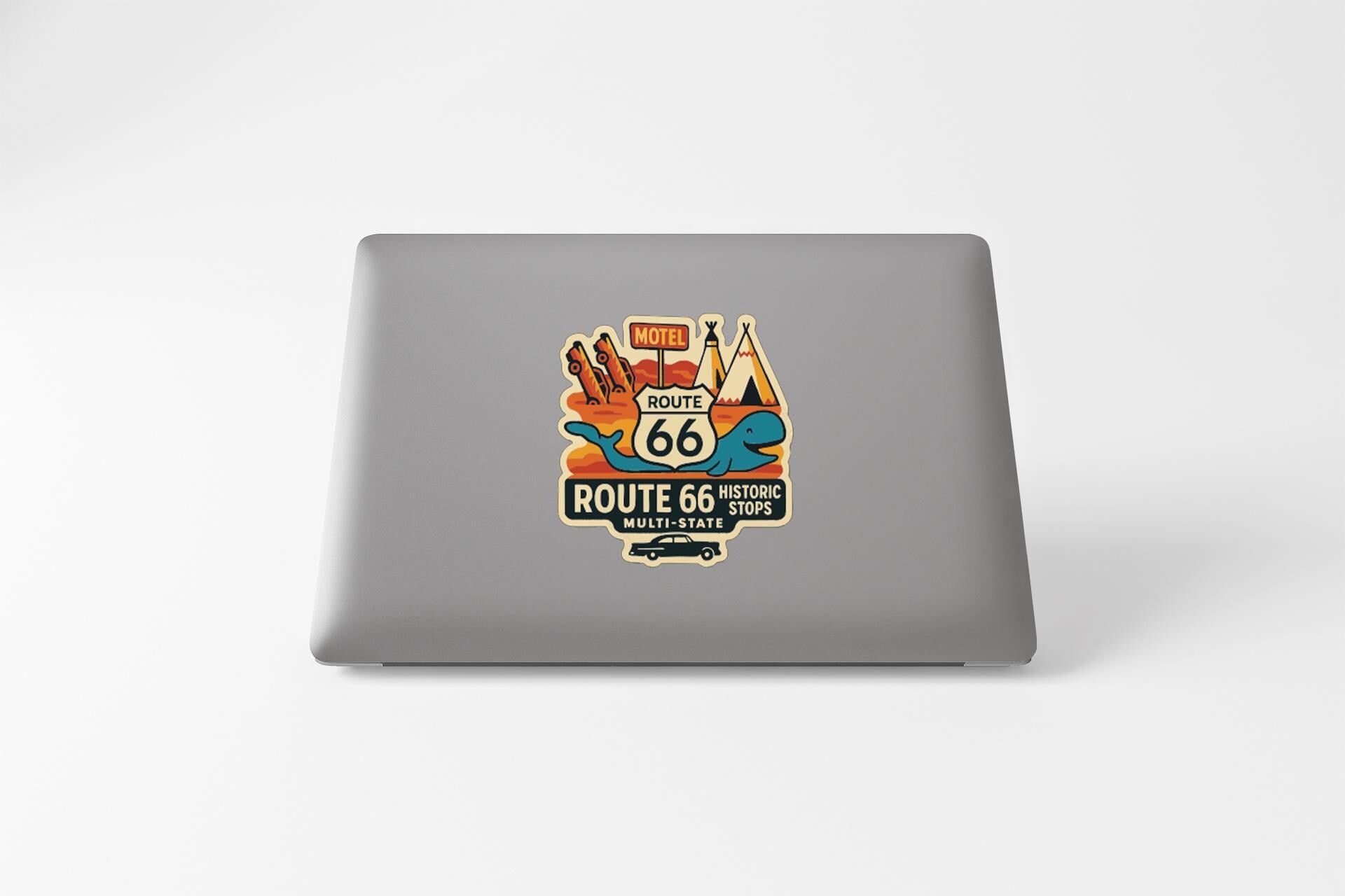 a sticker on a laptop with a colorful and vibrant design, depicting various elements associated with Route 66, such as a sign, a car, and a landscape.