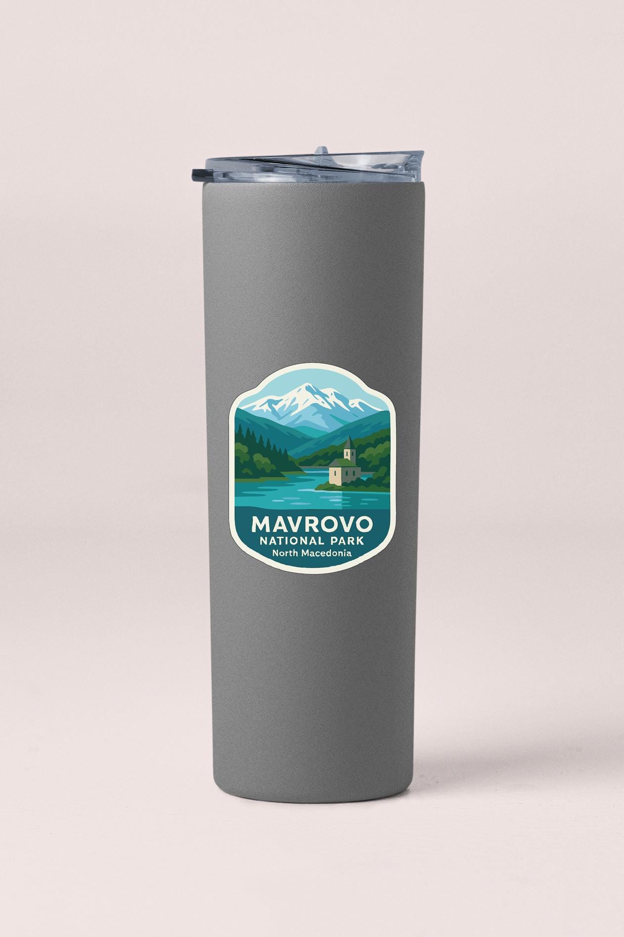 A gray insulated tumbler with a label that says "Mavrovo National Park North Mackenzie" on it.