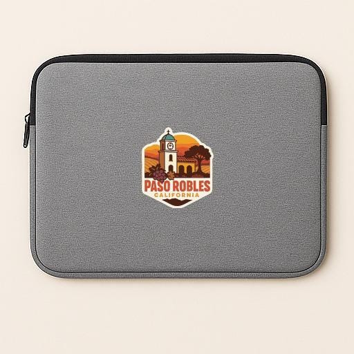 A gray laptop sleeve with a sticker featuring a clock tower and the text "PASO ROBLES CA. U.S.P.W."