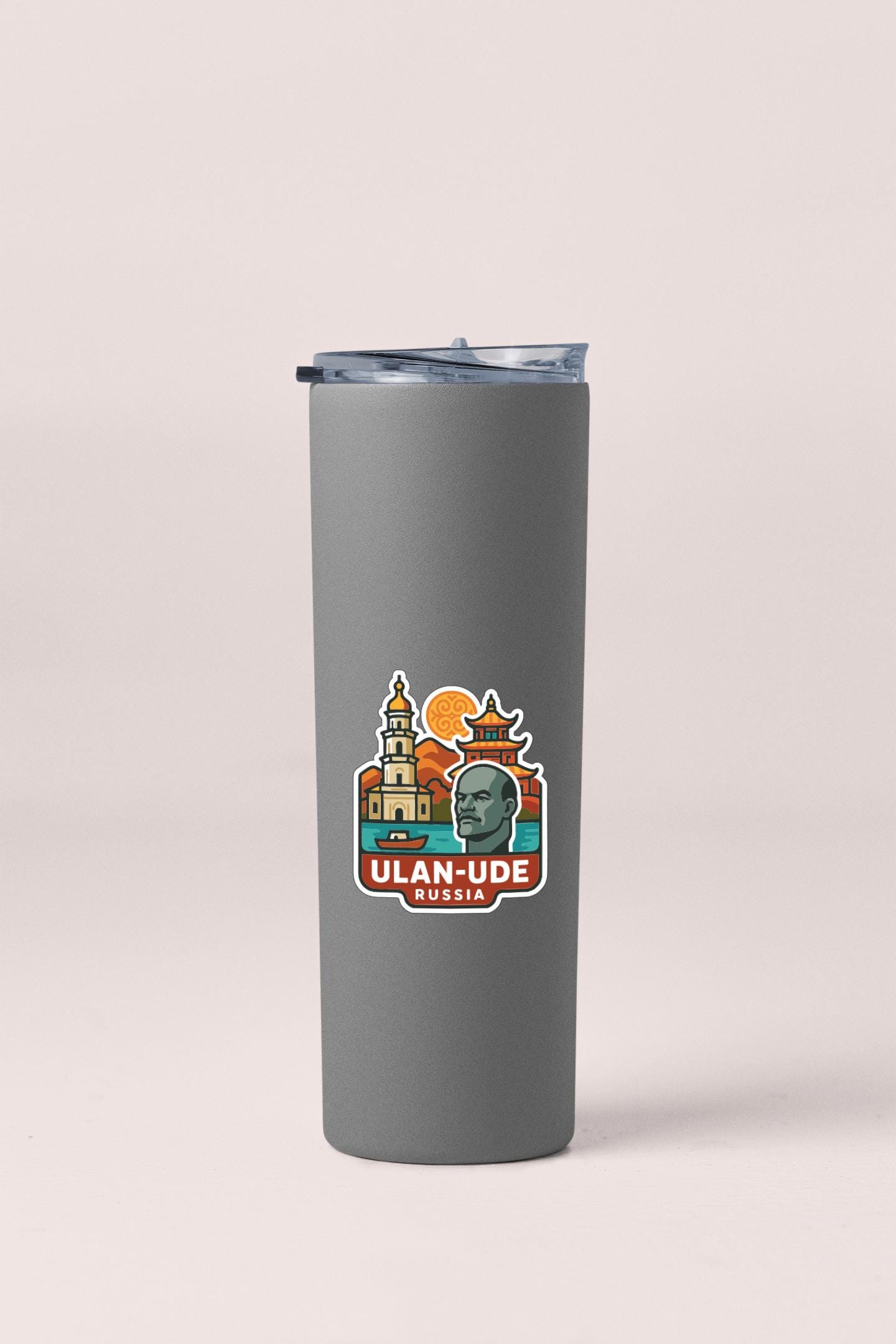 A gray insulated tumbler with a sticker depicting a city skyline and the text "ULAN-UDE RUSSIA".