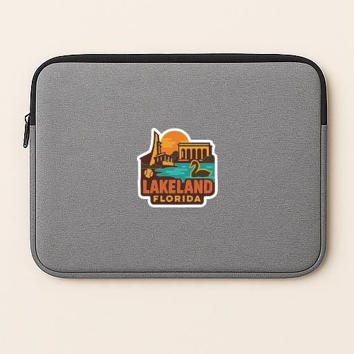 A gray laptop sleeve with a sticker depicting Lakeland, Florida.