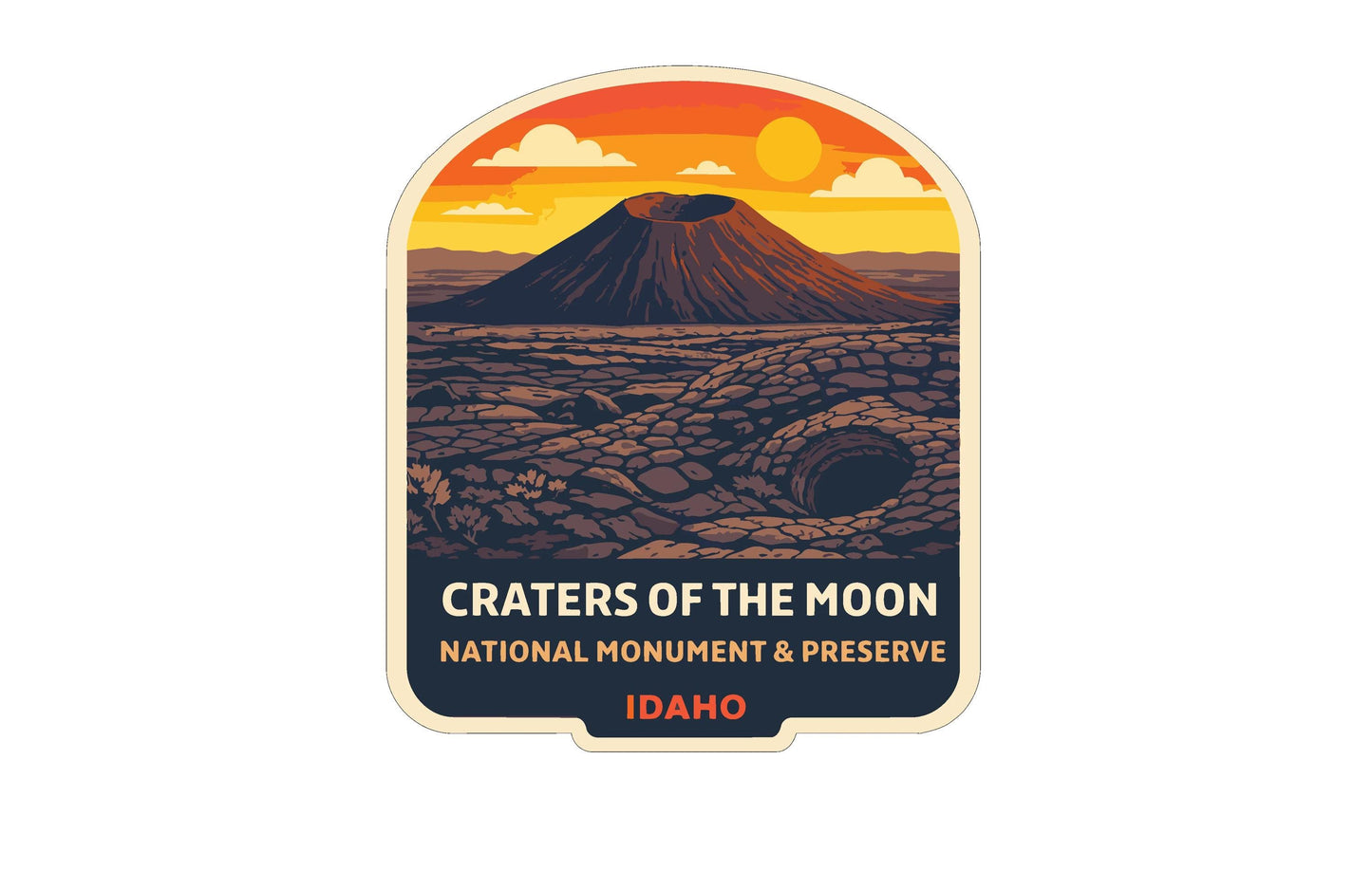 a sticker or label with an illustration of a mountain and a volcano, depicting Craters of the Moon National Monument and Preserve in Idaho.