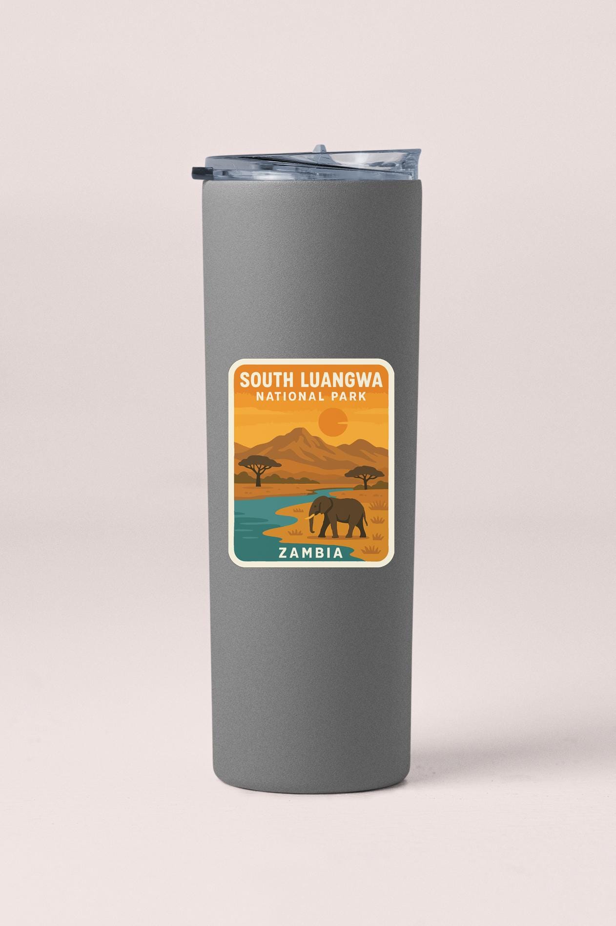 A gray tumbler with a label that says "SOUTH LUANGWA NATIONAL PARK ZAMBIA".