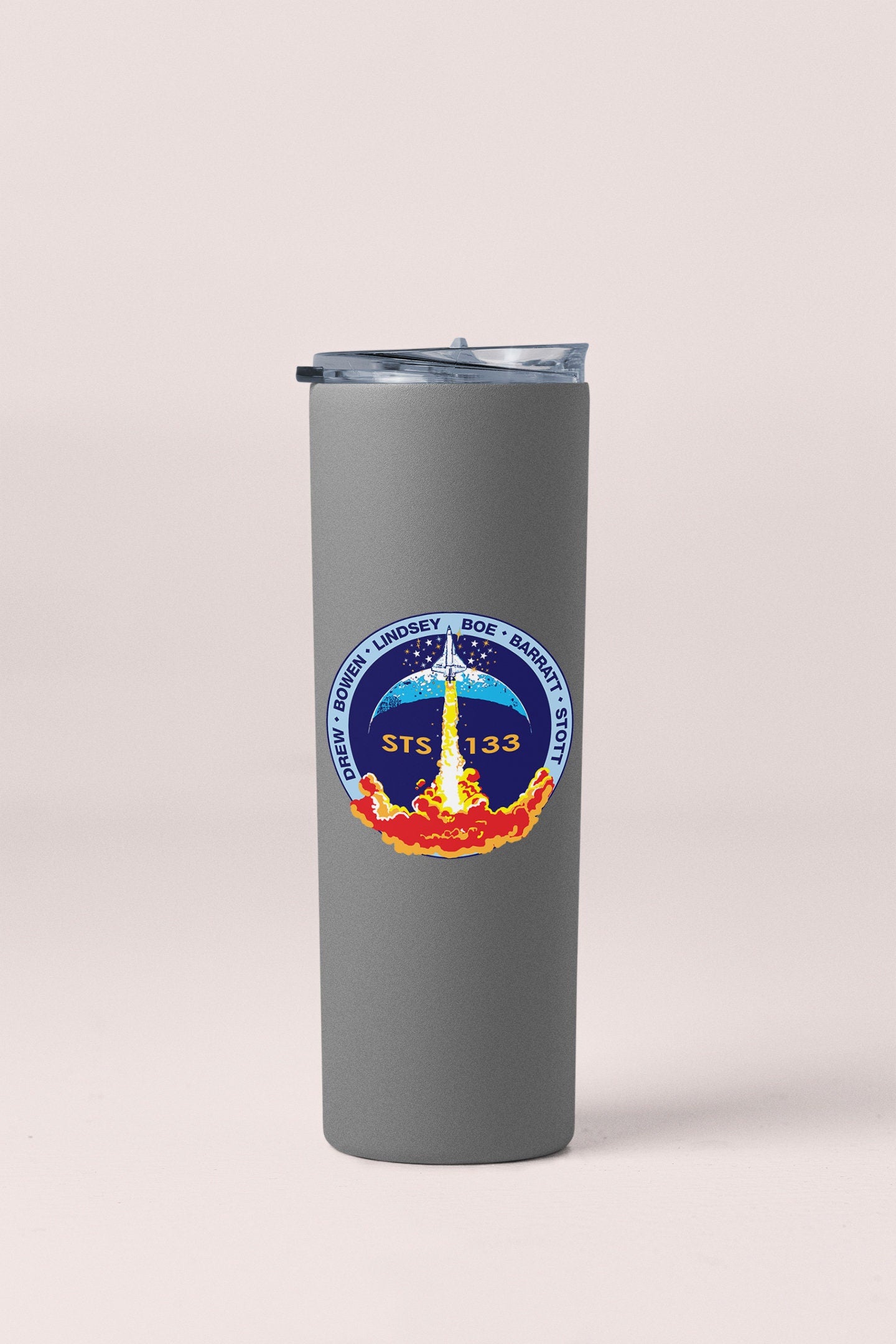 a stainless steel tumbler with a nasa emblem on it