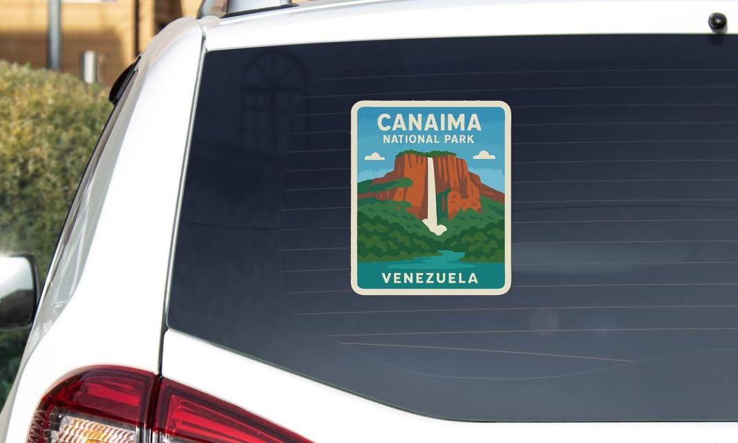 A sticker on the rear window of a car, depicting the landscape of Canaima National Park in Venezuela.