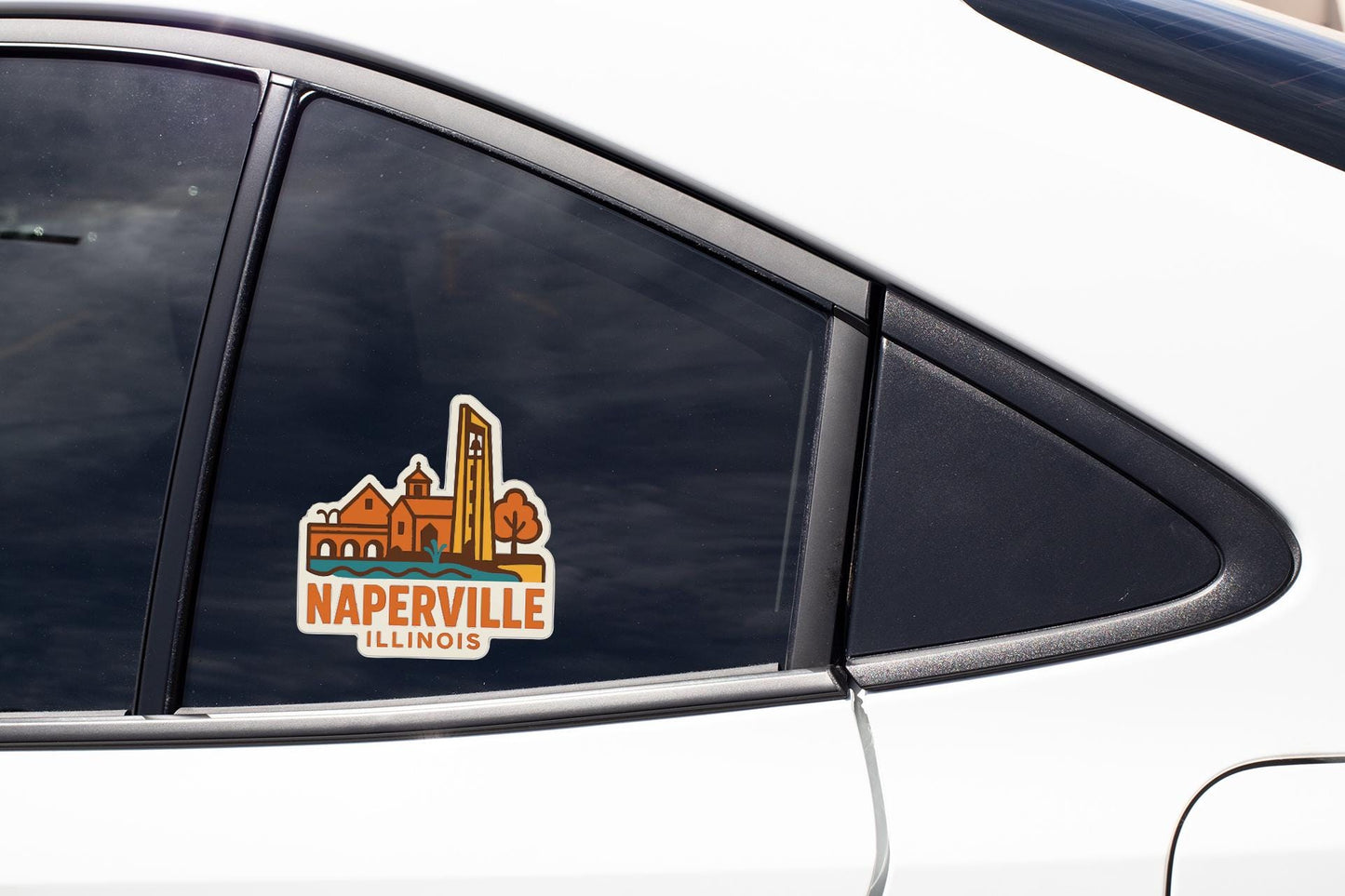 A sticker on the side of a car window, depicting the city of Naperville, Illinois.