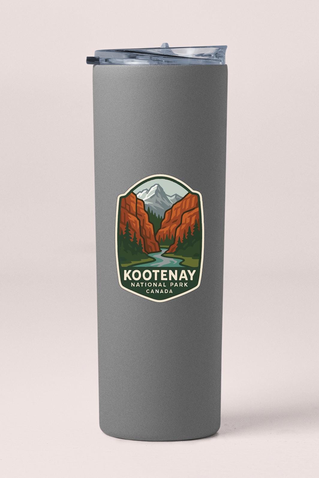 A gray cylindrical container with a lid and a label that says "Kootenay National Park Canada".