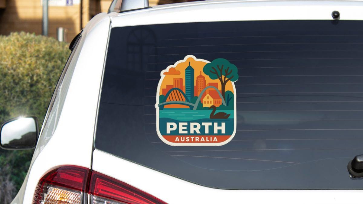 A sticker on the rear window of a car, depicting a cityscape with a tree and a bridge, along with the text "PERTH AUSTRALIA".