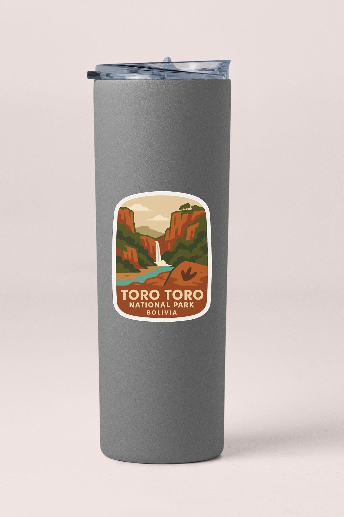 A gray insulated tumbler with a label that says "TORO TORO NATIONAL PARK BOLIVIA".