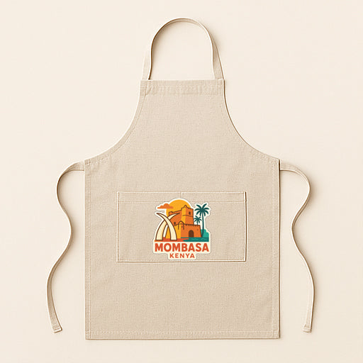 A beige apricot with a graphic design featuring a building, palm tree, and the text "Mombasa Kenya" printed on it.