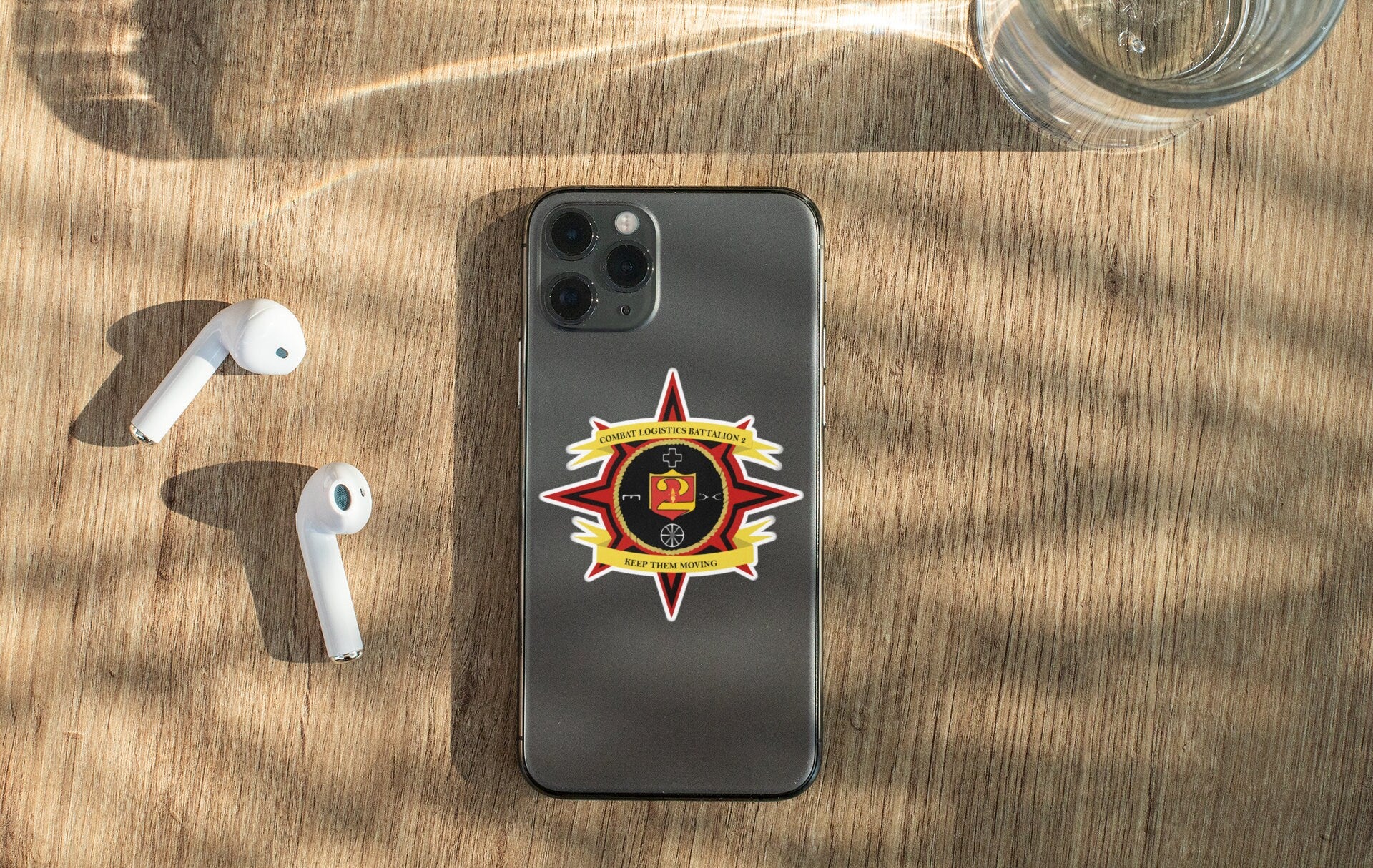 a cell phone sitting on top of a wooden table