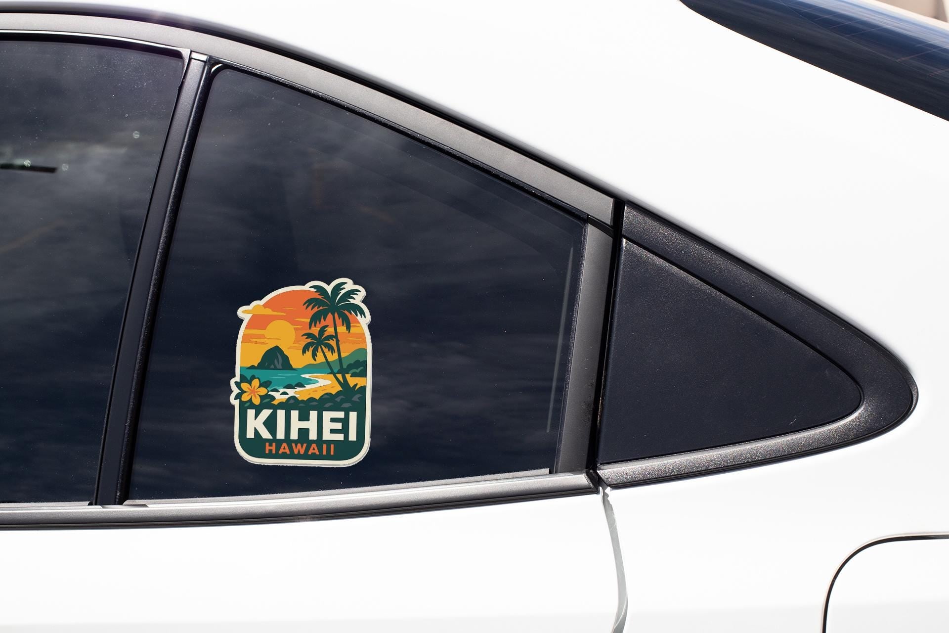 A sticker on the side of a car window, depicting a tropical beach scene with palm trees and a sunset.
