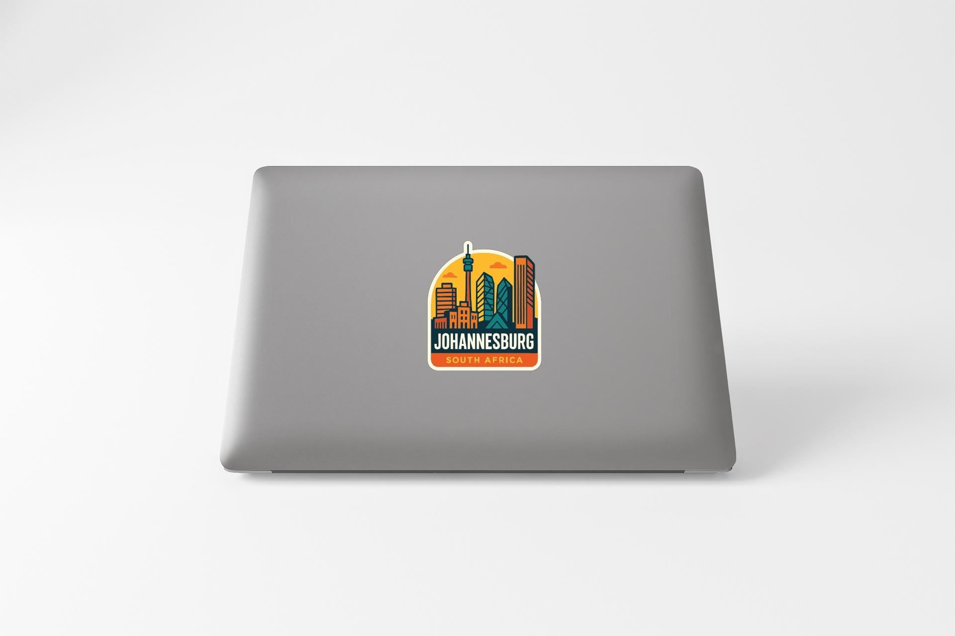 a sticker or decal of Johannesburg, South Africa, on the back of a laptop computer.