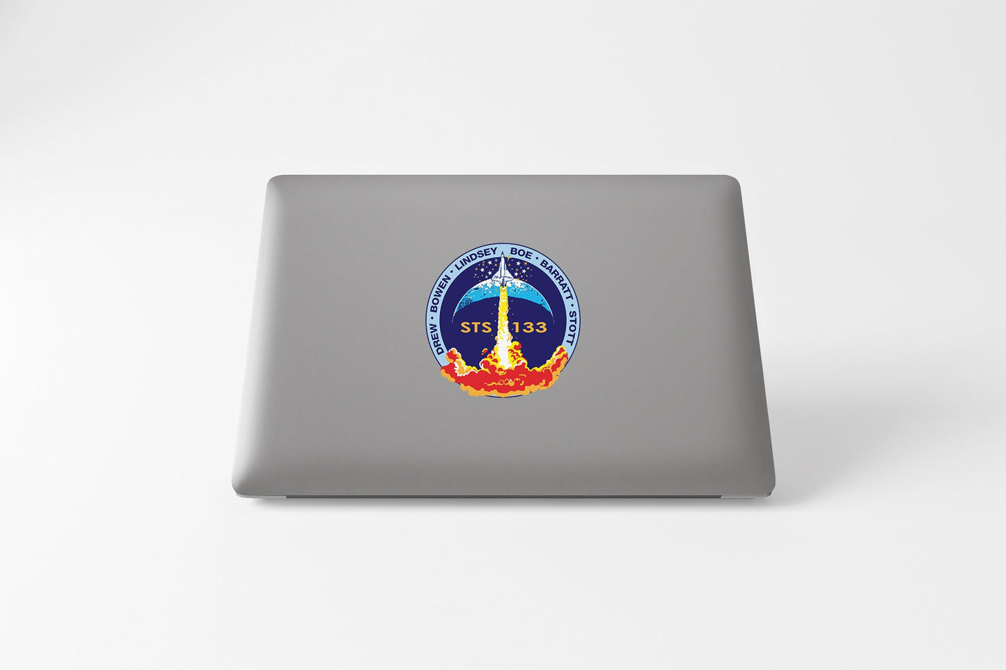 a laptop with a nasa emblem on it