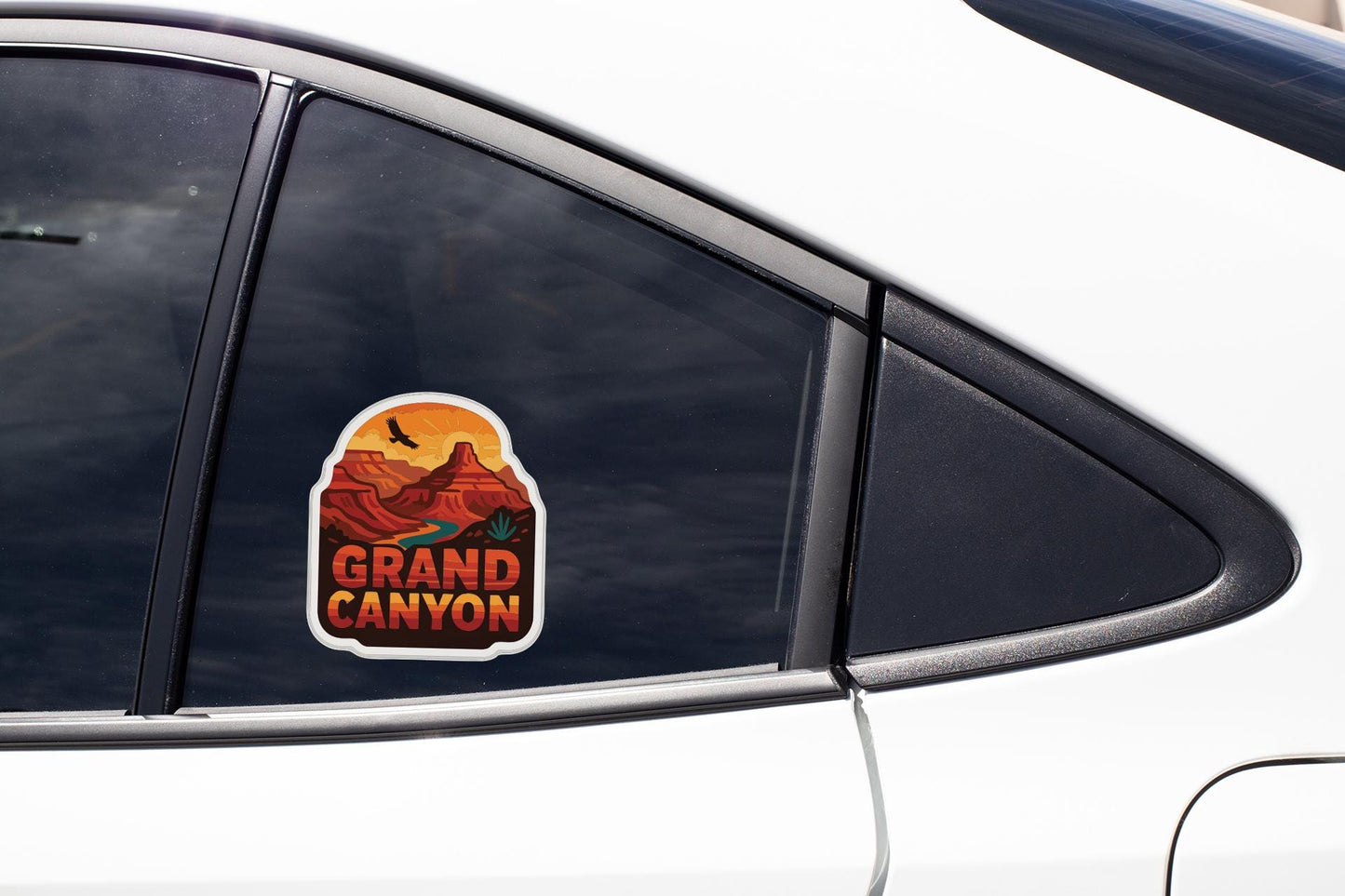A close-up of a car window with a sticker of the Grand Canyon on it.