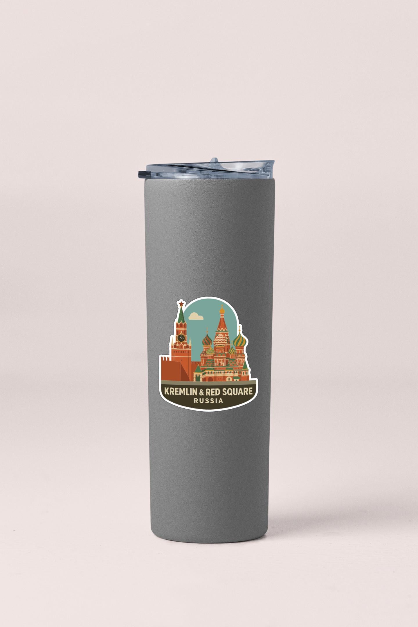 A gray tumbler with a sticker depicting the Kremlin and Red Square in Moscow, Russia.