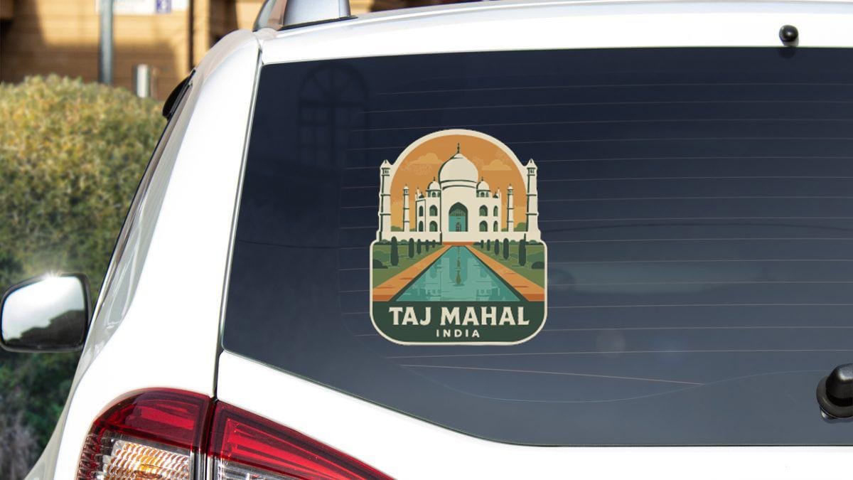 A sticker on the rear window of a car depicting the Taj Mahal, a famous landmark in India.