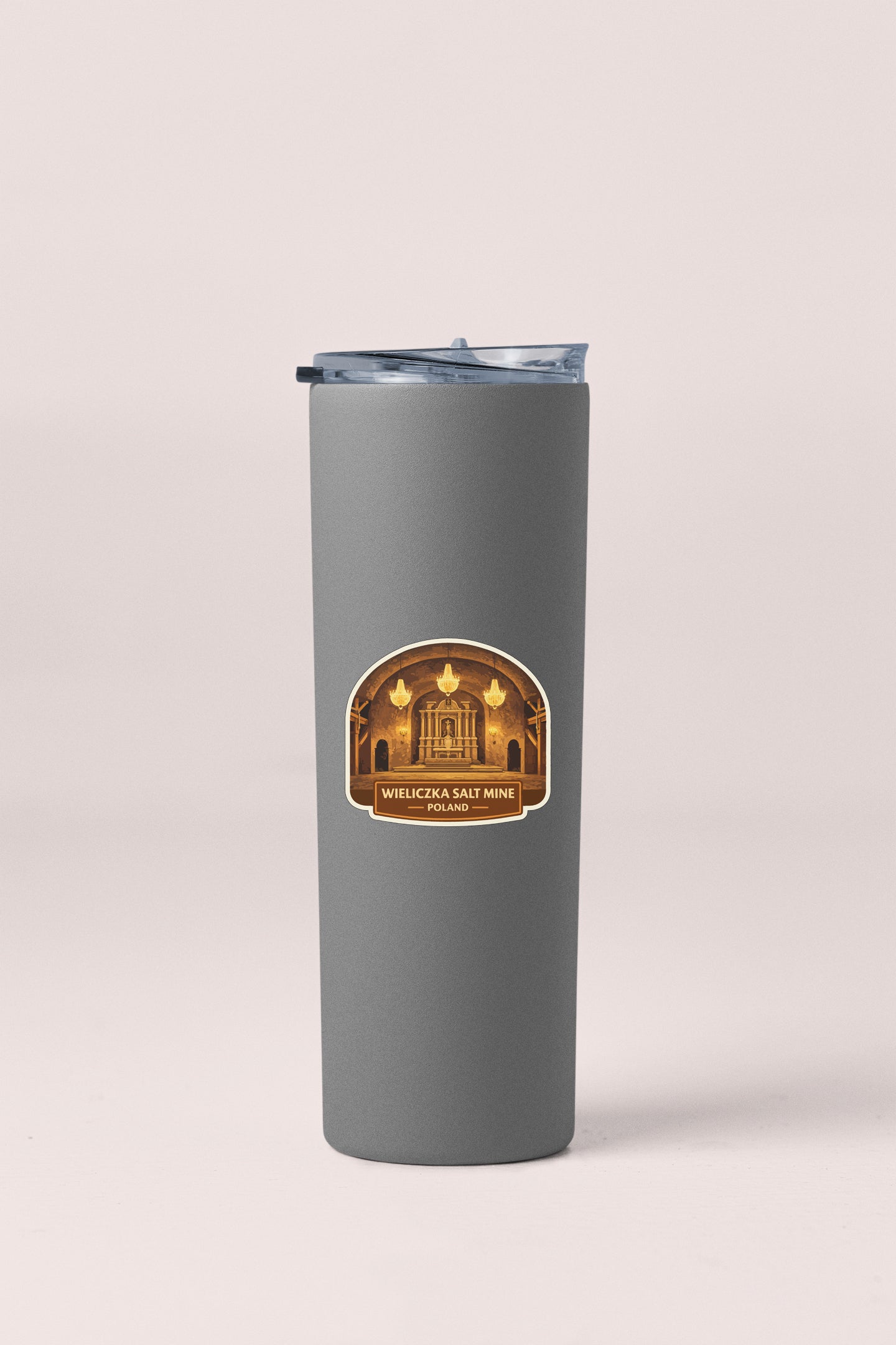 A gray cylindrical container with a lid and a label featuring an image of a building.