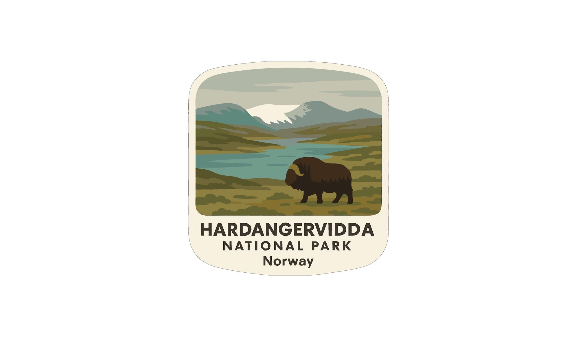 a large, brown bison standing in a grassy field with mountains in the background.