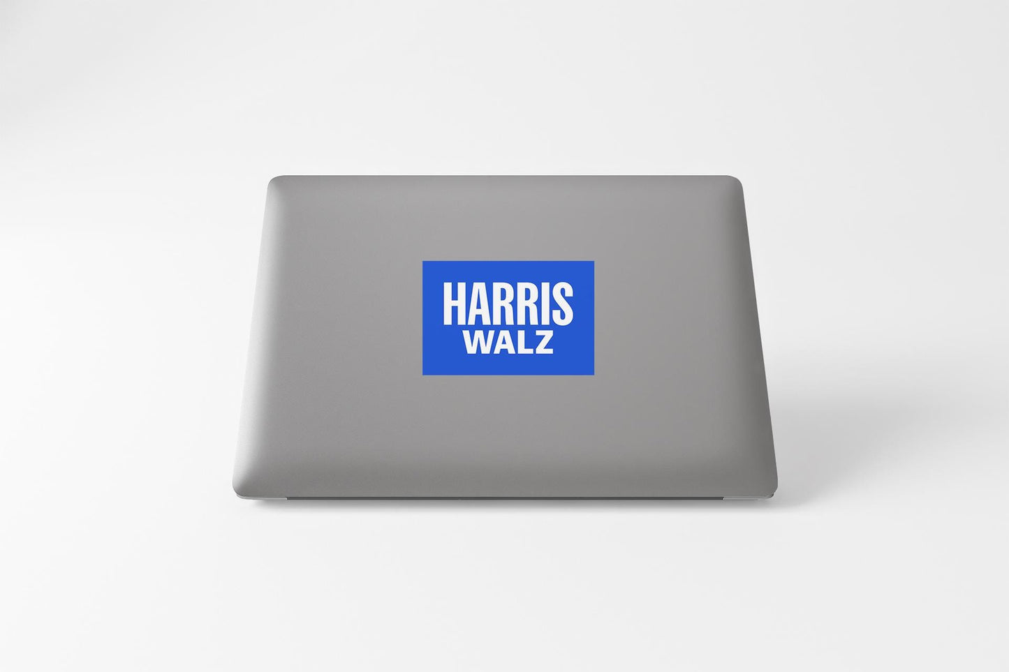 a laptop with a sticker on it that says harris walz