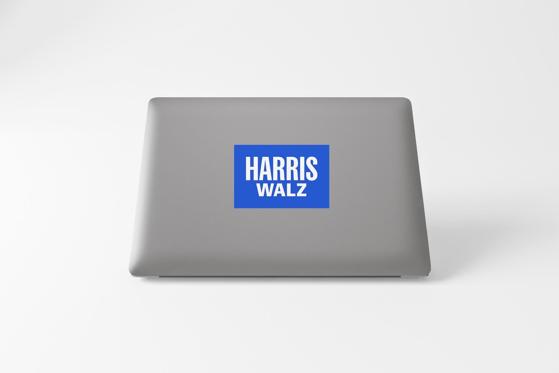 a laptop with a sticker on it that says harris walz