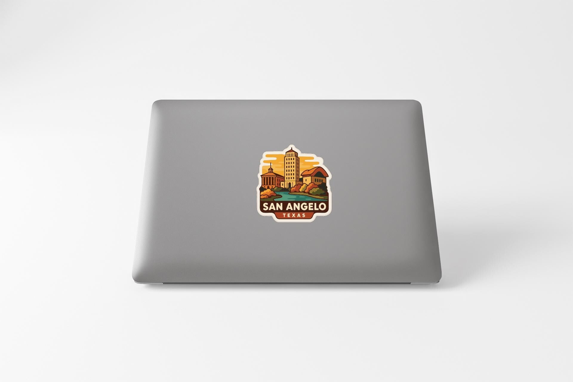 a sticker of San Angelo, Texas, on the back of a laptop.