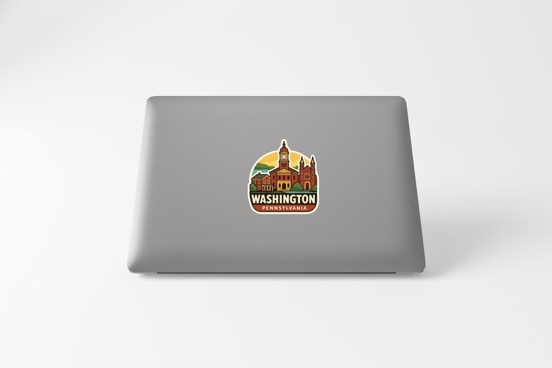 A sticker on the back of a laptop displaying an illustration of Washington, Pennsylvania.