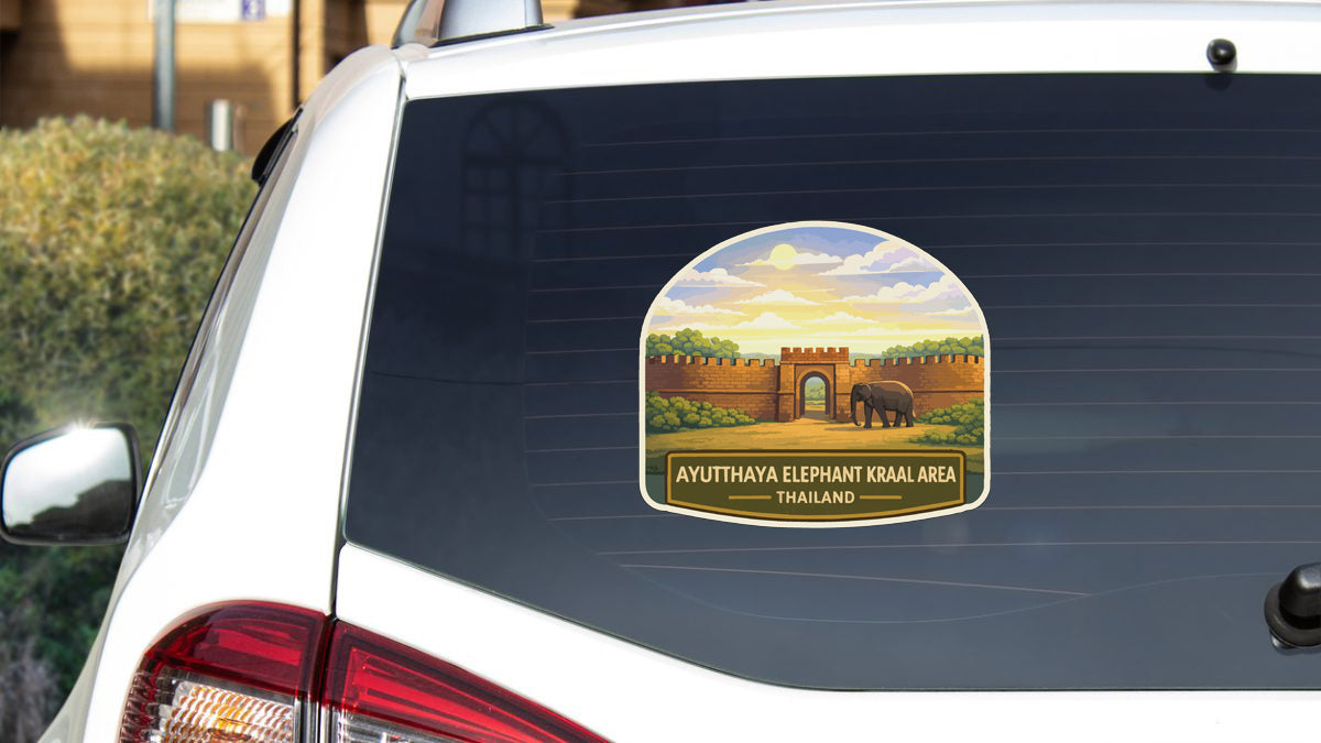 a sticker on the rear window of a car, depicting an elephant and a castle.