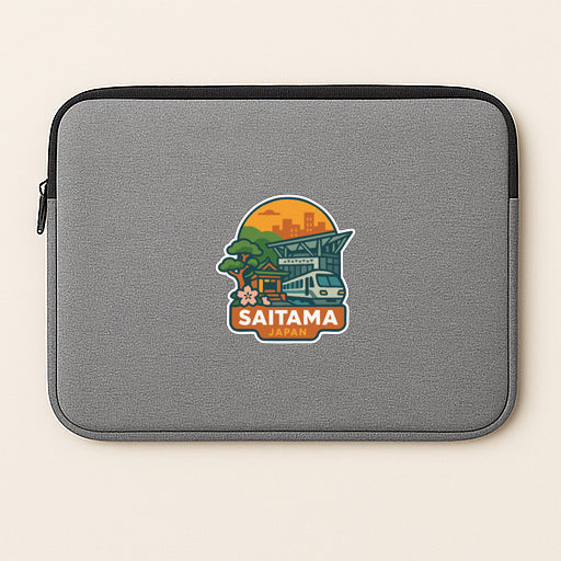 a gray laptop sleeve with a sticker of a cityscape and a train.