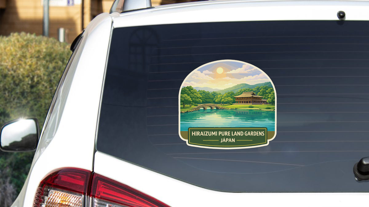 A sticker on the rear window of a car, depicting a scenic landscape with a lake, mountains, and a temple.