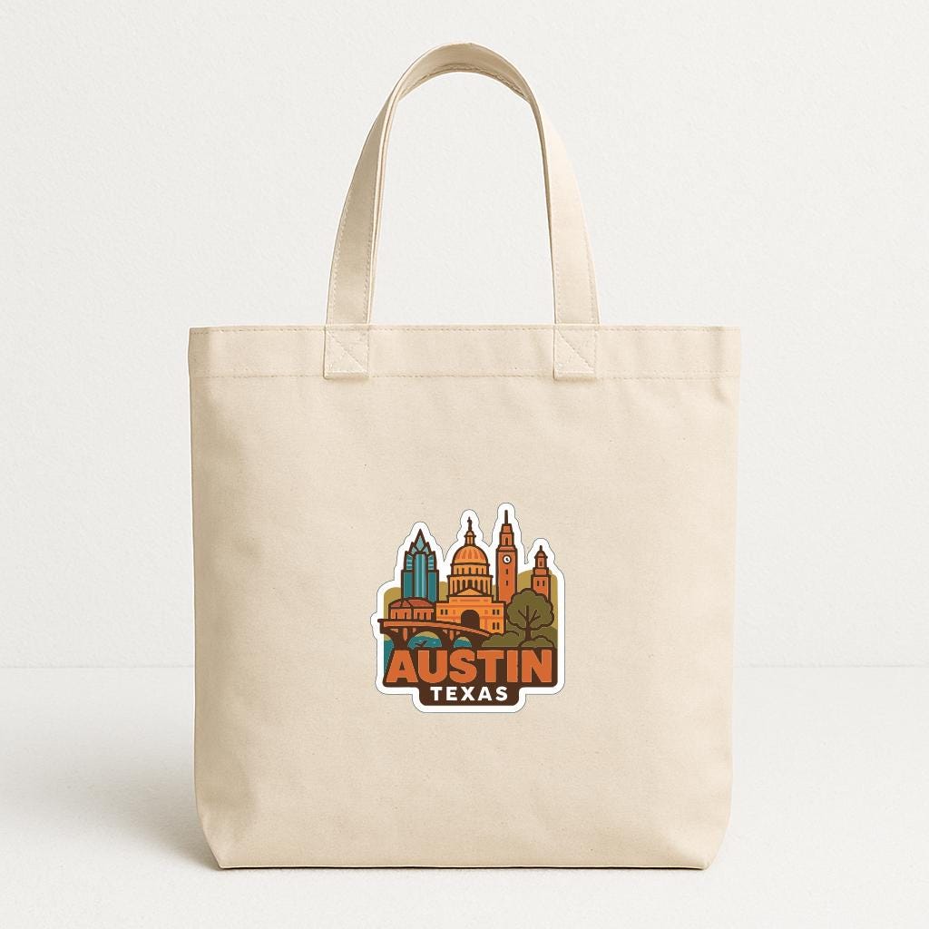 A beige tote bag with a printed image of the city of Austin, Texas, featuring colorful buildings and landmarks.