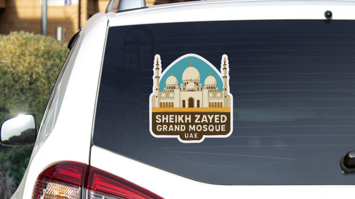 A sticker on the rear window of a car that says "Sheikh Zayed Grand Mosque" and "UAE".