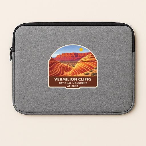 a gray laptop sleeve with a label that says "VERMILION CLIFFS NATIONAL MONUMENT ARIZONA".