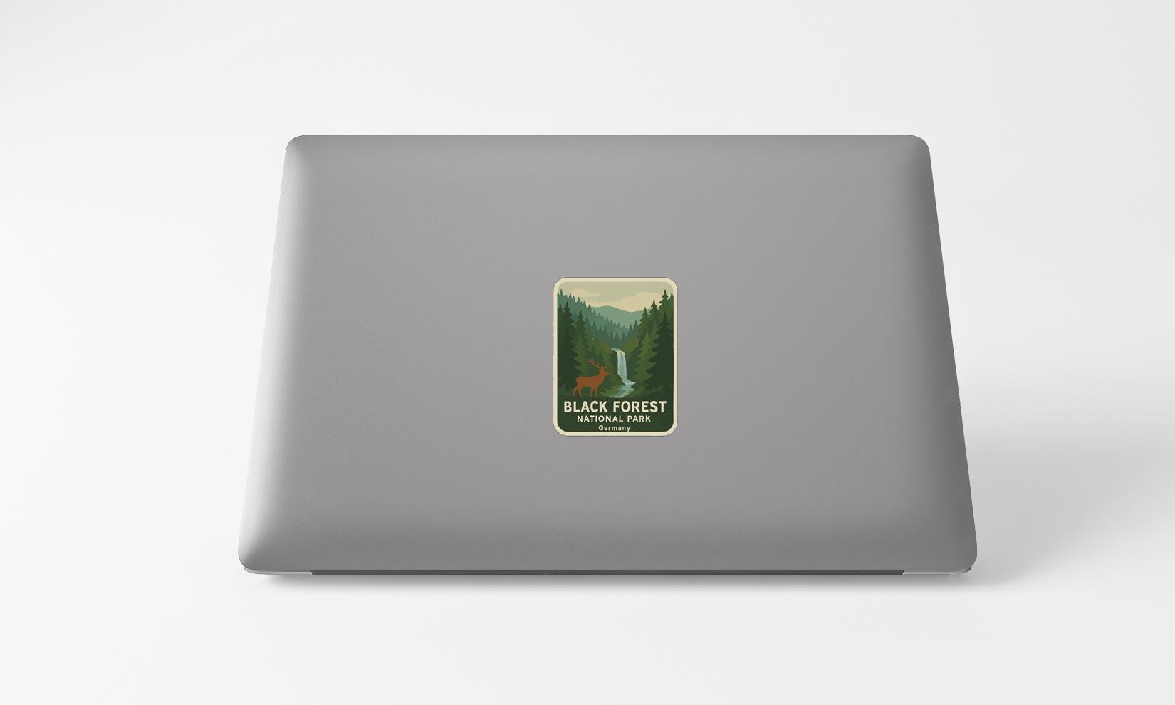 A sticker on the back of a laptop that says "BLACK FOREST NATIONAL PARK".
