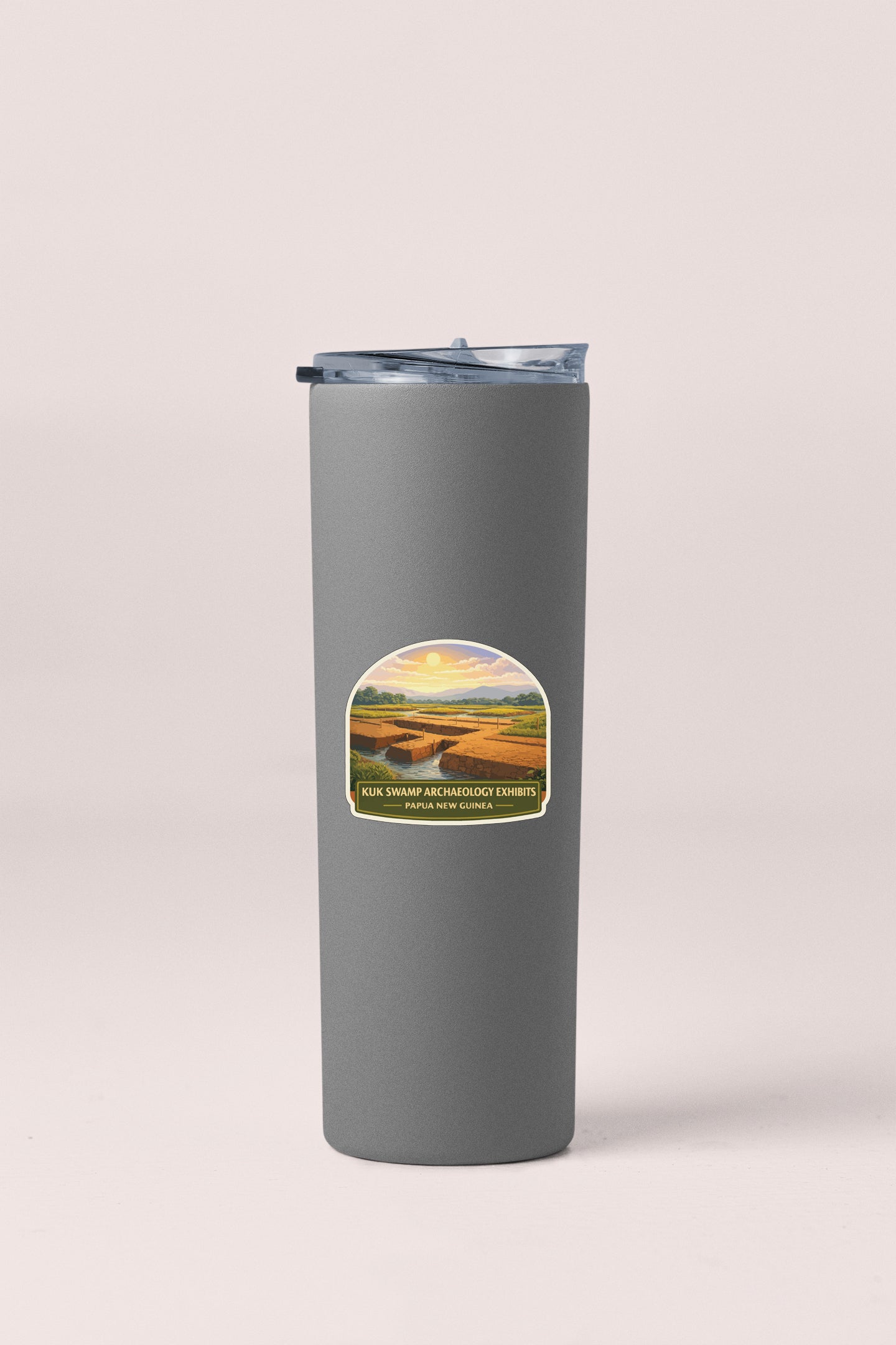 A gray cylindrical thermos with a lid and a label featuring a landscape scene.