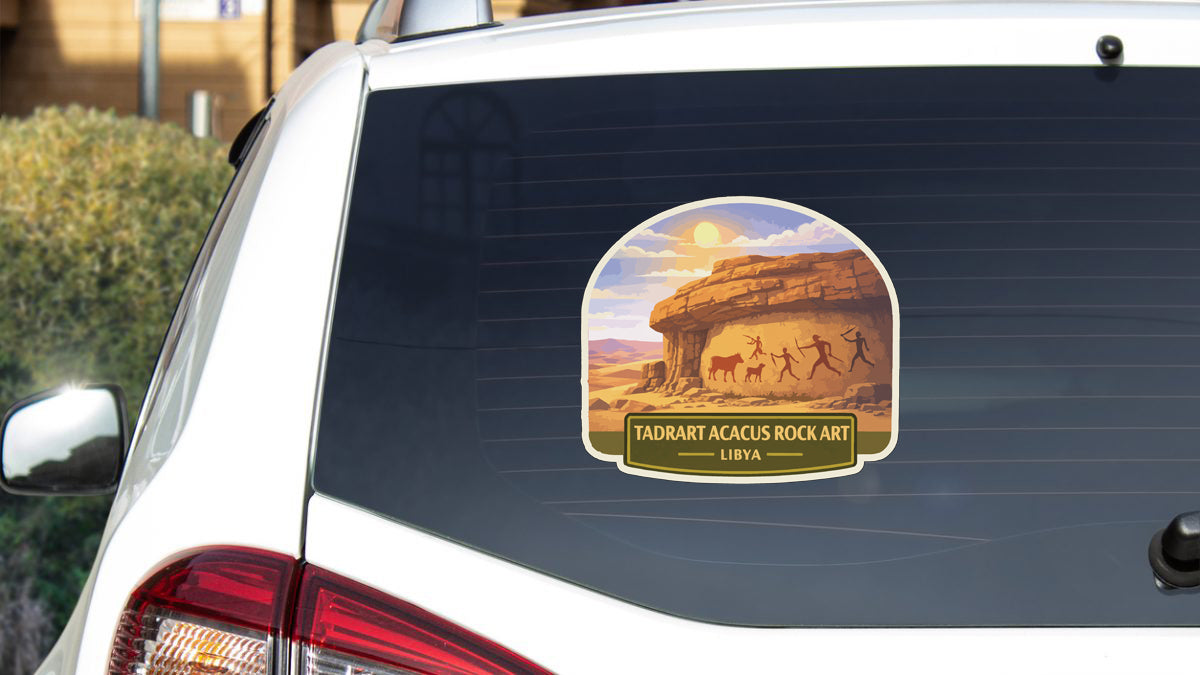 a sticker on the rear window of a white car, depicting a desert landscape with rock formations and people walking through the area.