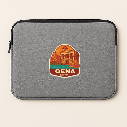 A gray laptop sleeve with a graphic design depicting a building and landscape, along with the text "QENA EGYPT".