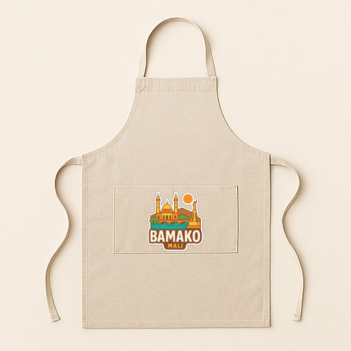 A beige apricot with a graphic design featuring a city skyline and the text "BAMAKO" printed on it.