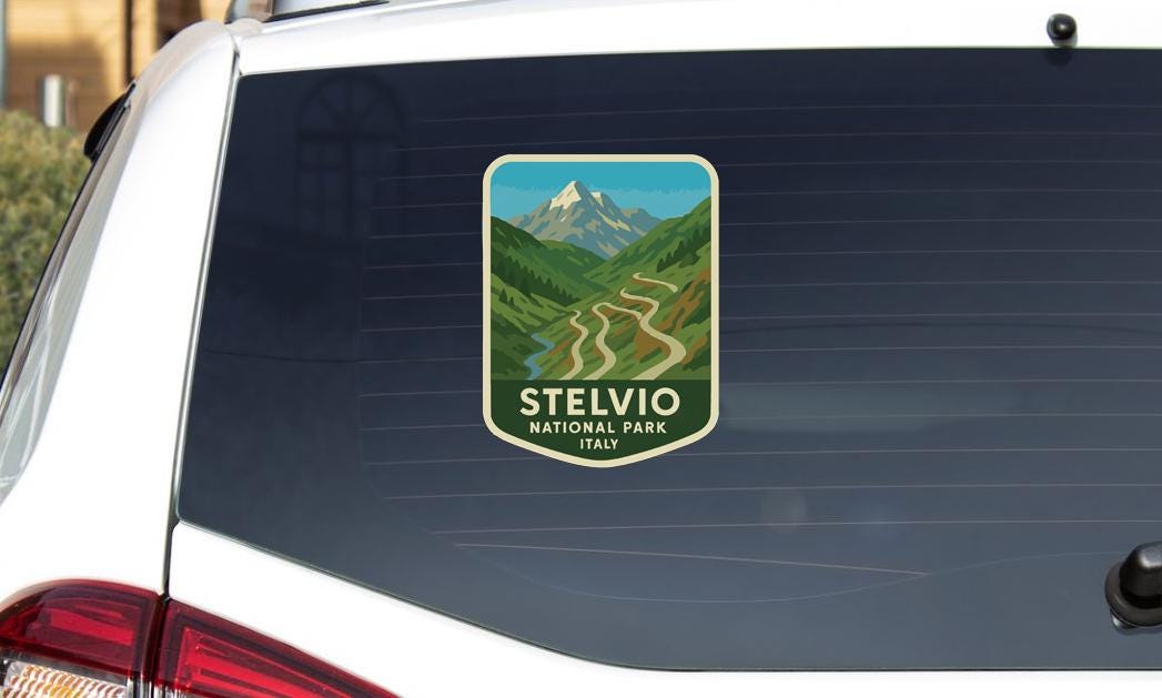A sticker on the rear window of a car that says "Stelvio NATIONAL PARK ITALY".