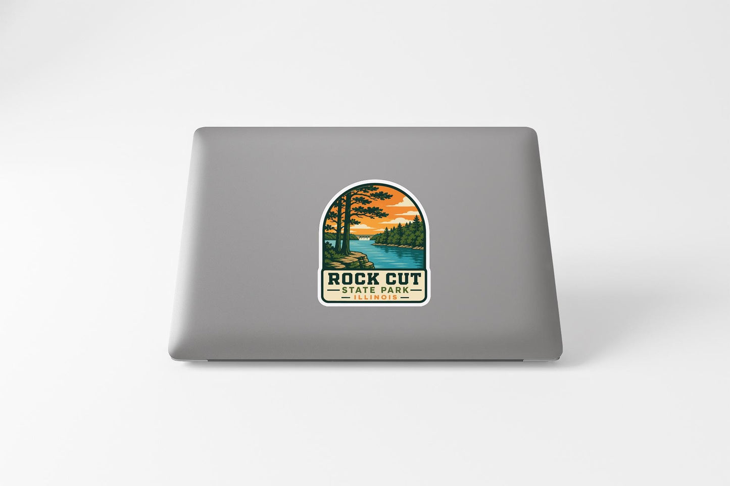 a sticker with a scenic landscape of a lake and trees, along with the text "ROCK CUT STATE PARK".