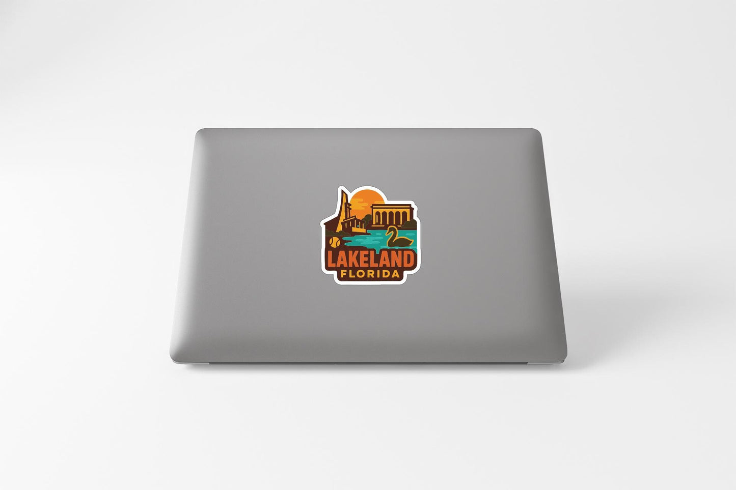 a sticker or decal of Lakeland, Florida, on the back of a laptop computer.