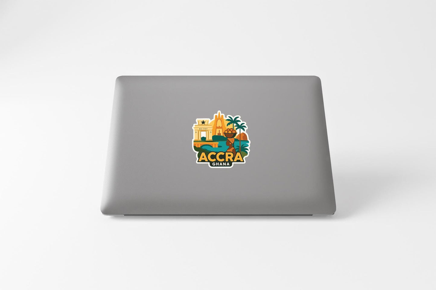 a sticker with a graphic of a tropical location, likely representing Accra, Ghana.