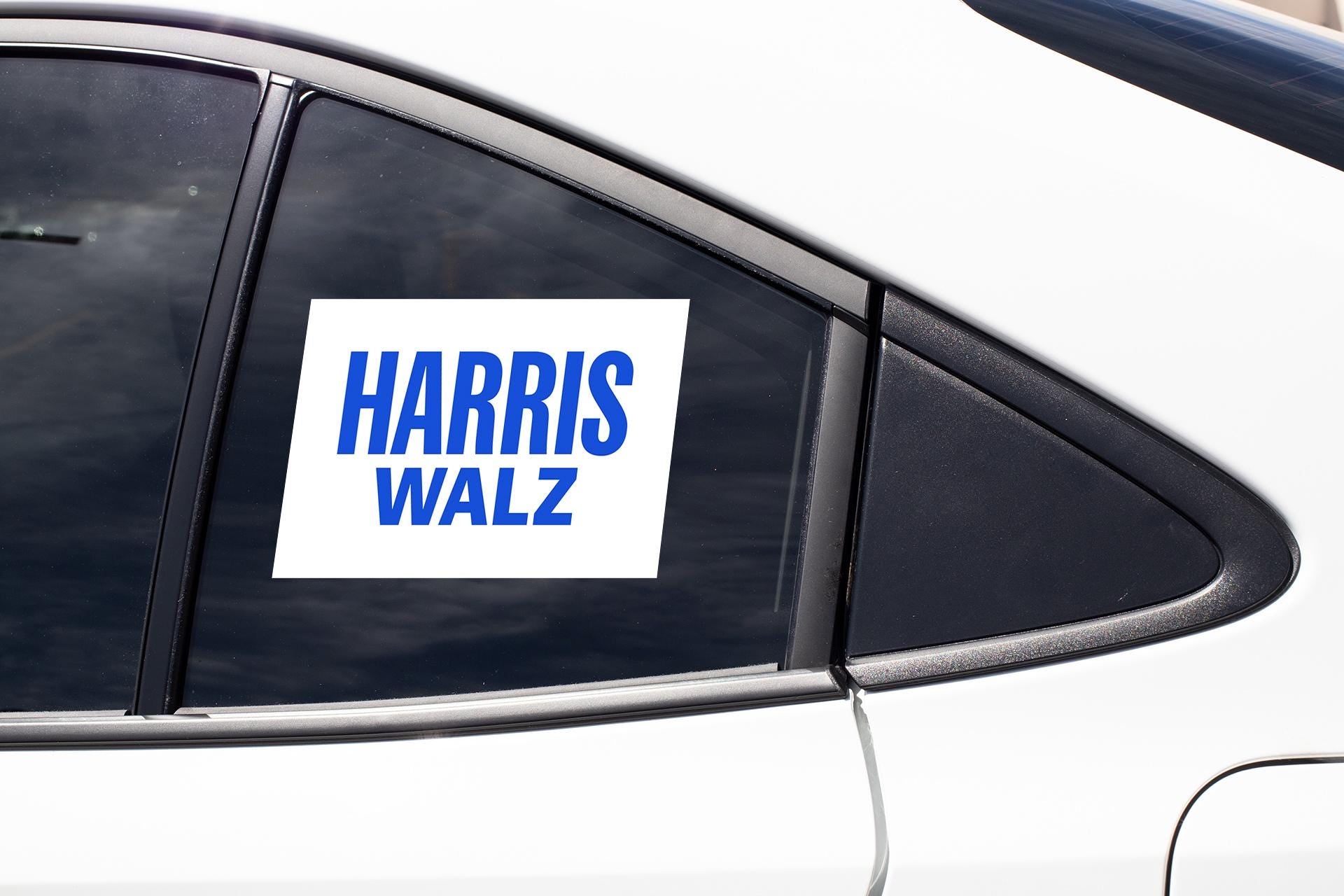 a sticker on the side of a car that says harris walz