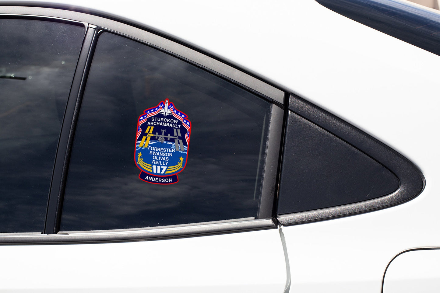 a close up of a car mirror with a sticker on it