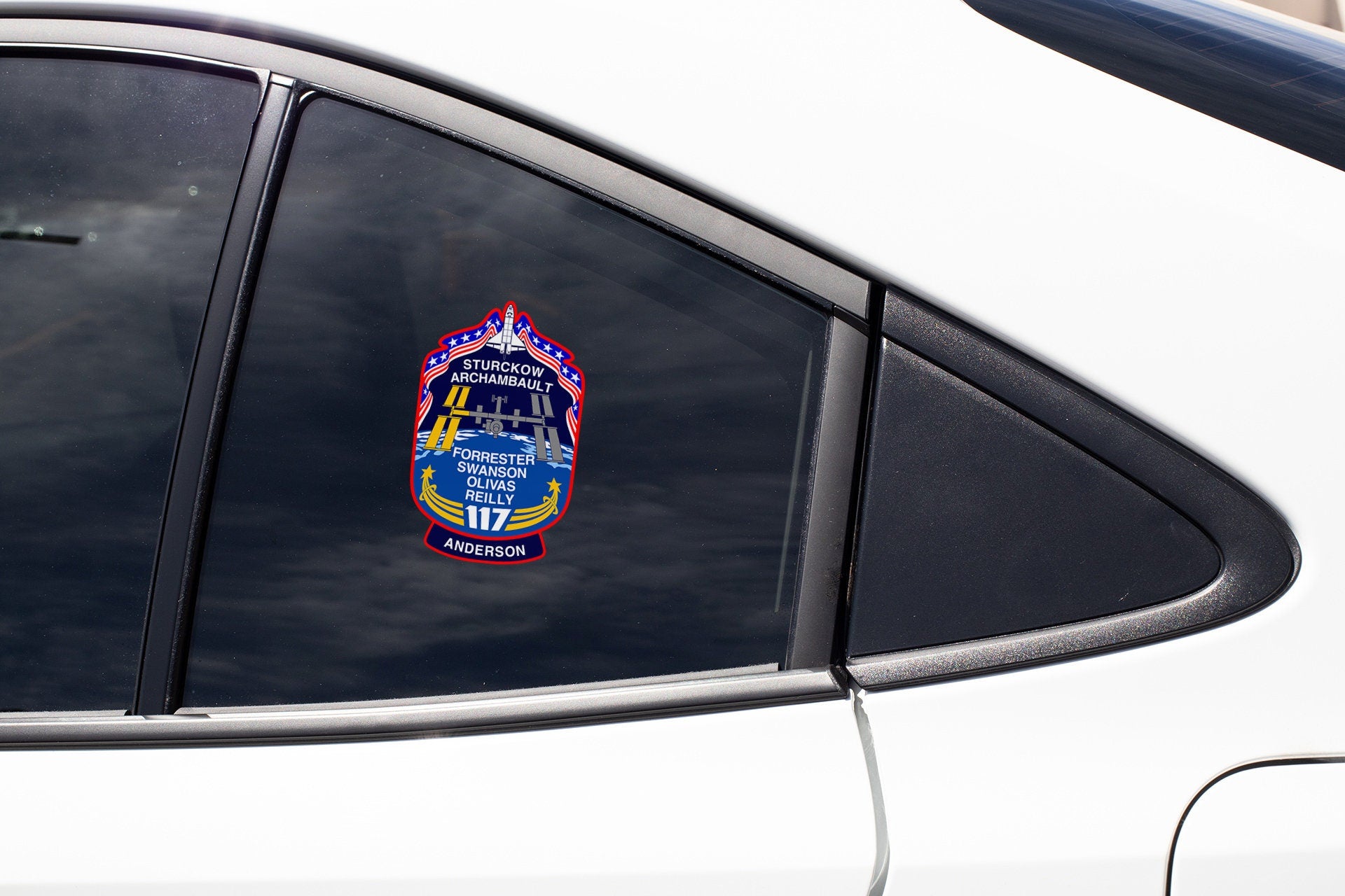 a close up of a car mirror with a sticker on it