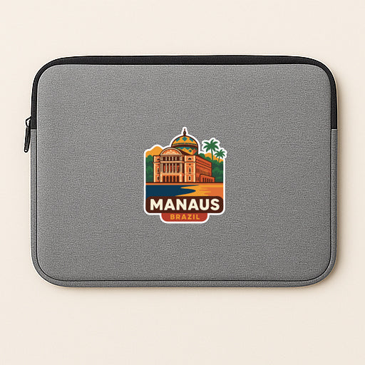 A gray laptop sleeve with a sticker depicting the Manaus skyline in Brazil.