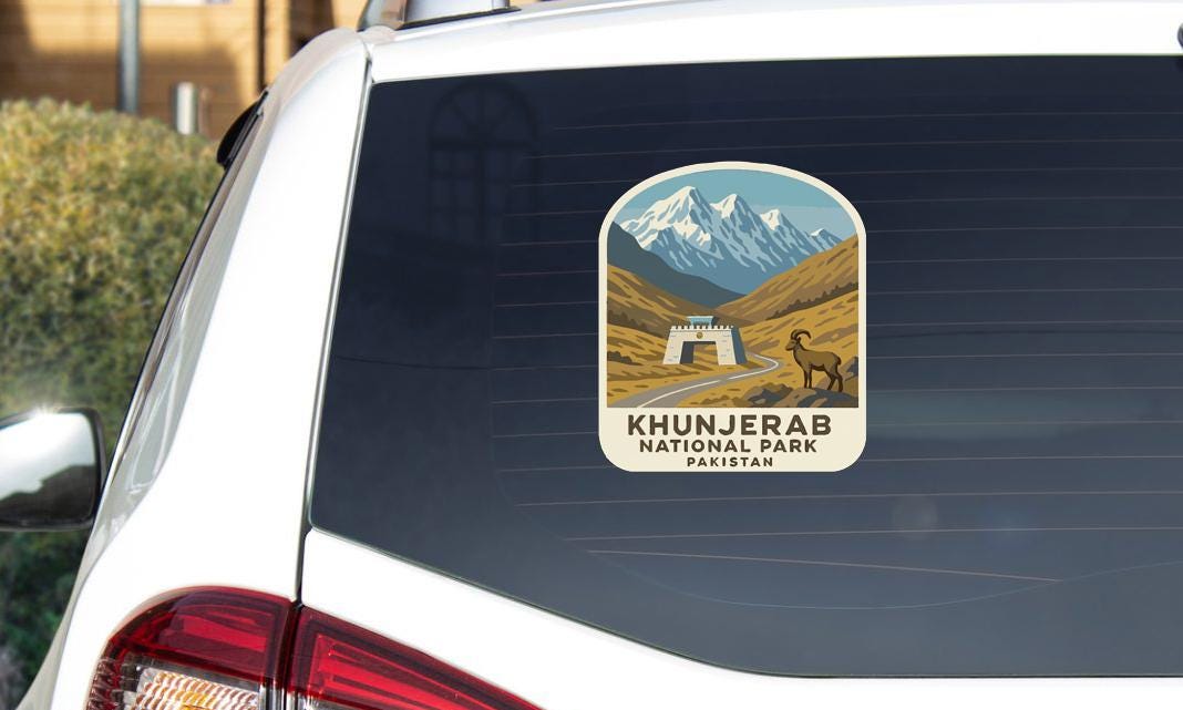 A sticker on the rear window of a car that says "Khanjerab National Park Pakistan".