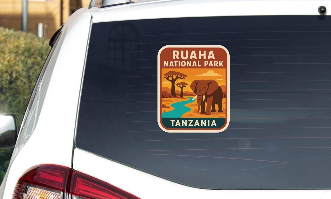 a sticker on the rear window of a car that says "RUAHAN PARK TANZANIA".