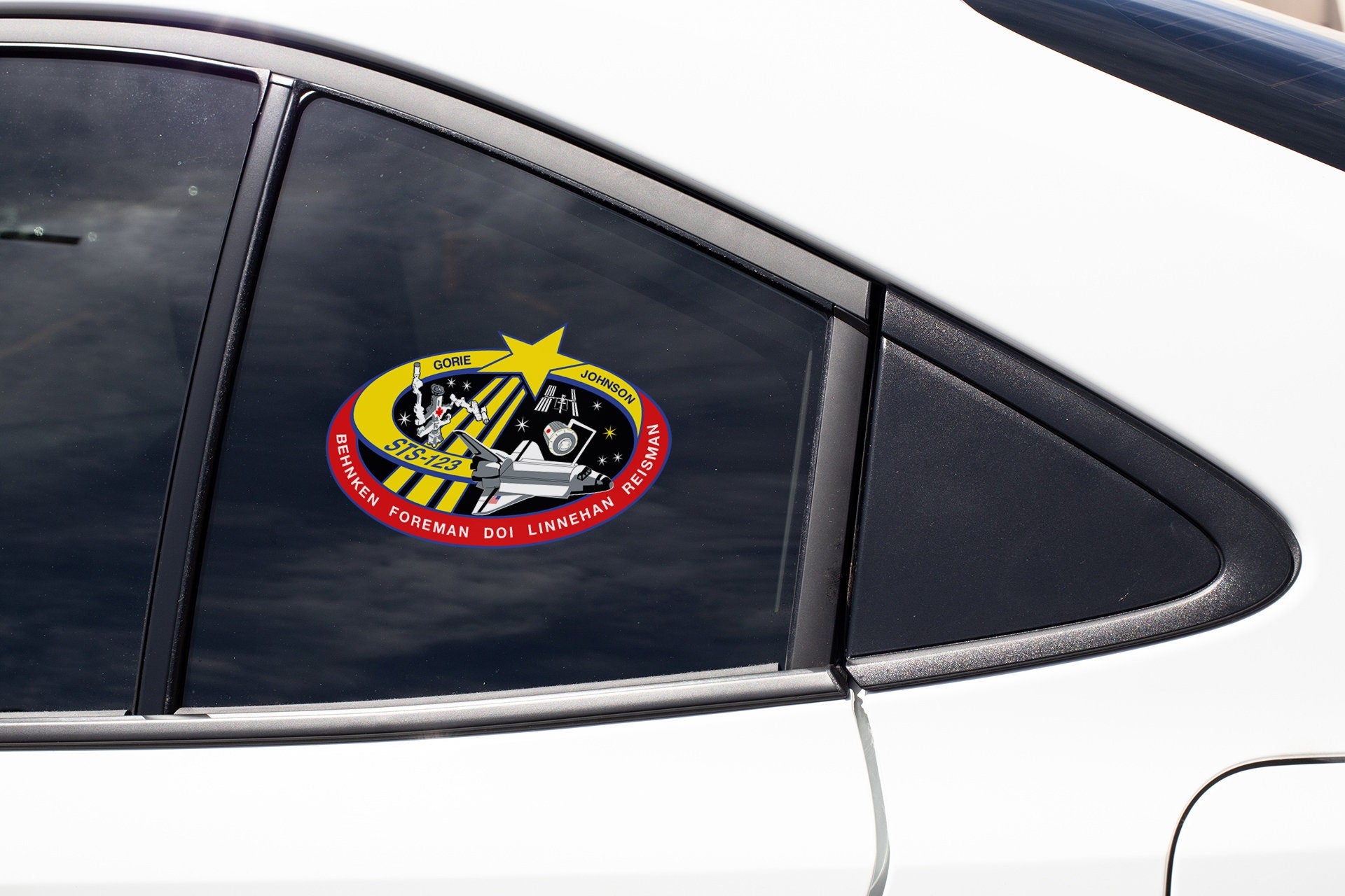 a close up of a car window with a sticker on it