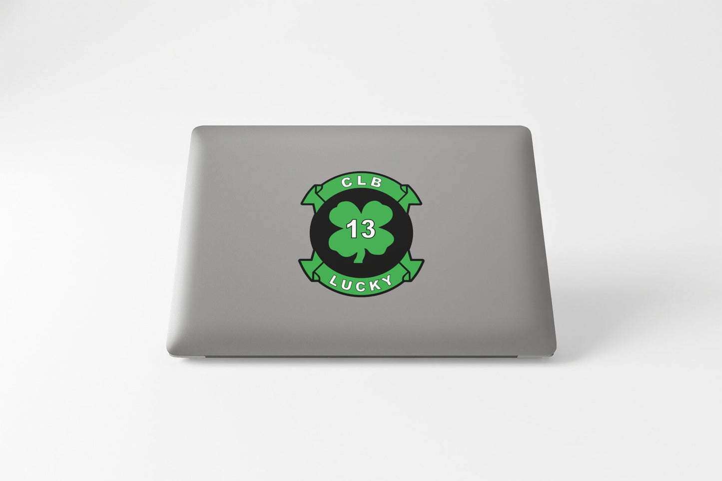 a laptop that has a clover on it